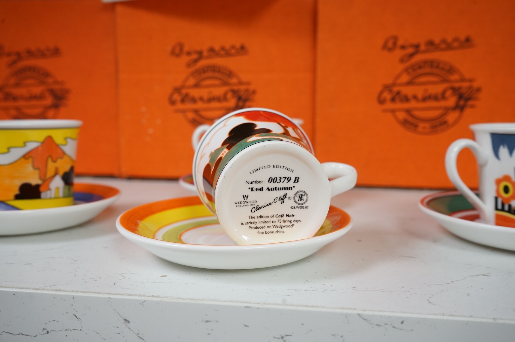 Four boxed limited edition Clarice Cliff cups and saucers to include Fantasque Mountain and Red Autumn, saucers 11.5cm in diameter